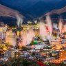 Steam rises from hot spring bath houses in Beppu.