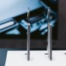 The Samsung Galaxy S25 Edge (right) next to metal slabs represented the thickness of the S23 and S24.