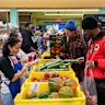 Volunteers sort donated food items at a food bank in New York. 
