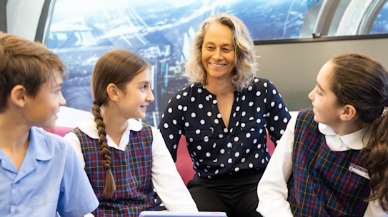 A fan of check-ins: Felicity Williamson with students Budd Corser, Emily Walsh and Jayla Mougios.