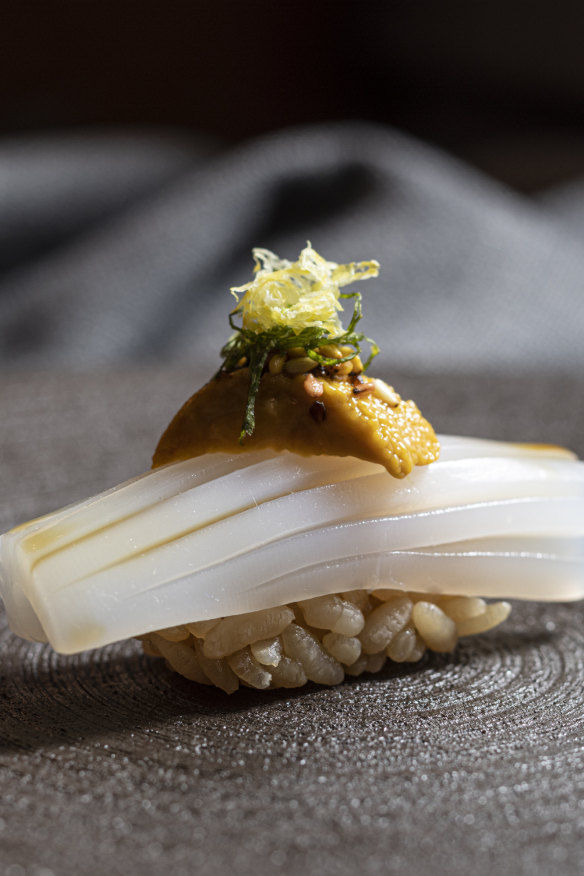 Calamari nigiri topped with sea urchin.