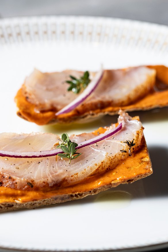Salt-cured kingfish pancetta tostadas with mojo rojo.