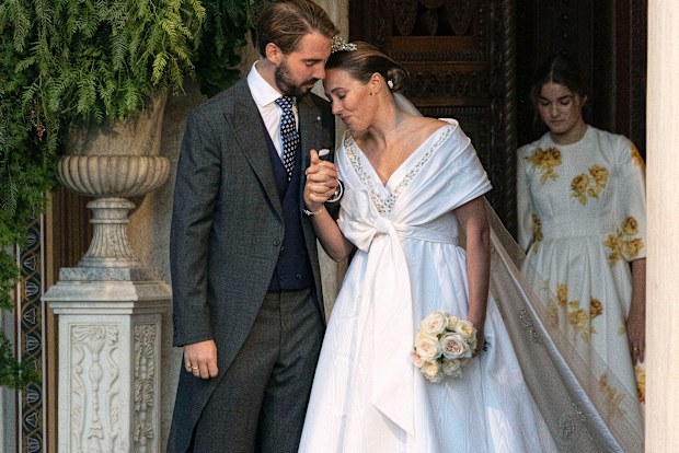 Prince Philippos, son of former King of Greece Constantine II, and his wife Nina Flohr leave the Athens Orthodox Cathedral following their wedding ceremony in Athens, Greece, October 23 (AP Photo/Yorgos Karahalis)