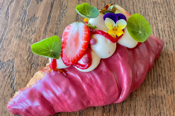 Floral croissant filled with yuzu mascarpone cream and dipped in raspberry chocolate for Mother’s Day at Madame and Yves, Clovelly.