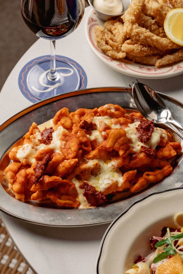 Baked vodka pasta and other dishes are more casual at Gambino’s rooftop bar.