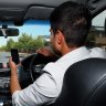 New roadside tech to warn Queensland drivers to stop using phones