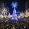 Crowds attend the lighting ceremony for Christmas decorations in Vigo, Spain.