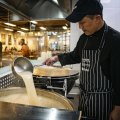 Head chef Sungjun Kim preparing bone broth at Hansang in Strathfield.