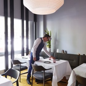 Charcoal leather banquettes create a tranquil mood.