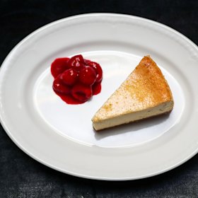 Cheesecake with poached raspberries. 