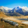 xxNZtrainÃÂ train journey new zealand nzÃÂ ; text by Tim Richards SUPPLIEDÃÂ https://media.greatjourneysofnz.co.nz/TranzAlpine passes Lake Sarah on a clear day, past snowy mountains.Licence:ÃÂ Royalty Free to use worldwide provided you abide by the Terms of Use, Brand Guidelines, Licence, Usage, and Expiry dates for each asset.Expiry:ÃÂ No expiry.