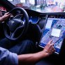 Tesla agrees to stop letting people play video games while driving