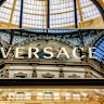A Gianni Versace SpA logo sits a above a window display at their store in the Galleria Vittorio Emanuele shopping mall in Milan, Italy, on Monday, Sept. 24, 2018. Handbag makerÂ Michael Kors Holding Ltd.Â is nearing an agreement to buy Versace after the Italian fashion house known for its baroque designs drew interest from several suitors, people familiar with the plans said. Photographer: Francesca Volpi/Bloomberg