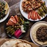 Eggs, sujuk, hummus, tabouli and pickles.