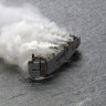 Freighter ship loaded with cars burns off Dutch coast
