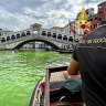 Venice’s waters turn fluorescent green near Rialto Bridge
