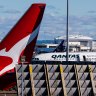 Qantas cuts flights, travellers dry up as Omicron bites
