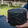 A slab of blacktop containing recycled plastics.