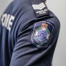 Three police officers were taken to hospital after allegedly being attacked by a group of people at Mitchelton.