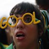 A Brazil soccer fan reacts to a goal by Cameroon against Brazil at the World Cup, hosted by Qatar, played on a screen set up at the FIFA Fan Fest Arena on Copacabana beach in Rio de Janeiro, Brazil, Friday, Dec. 2, 2022. 