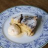 Dessert bread and butter pudding with vanilla ice cream.