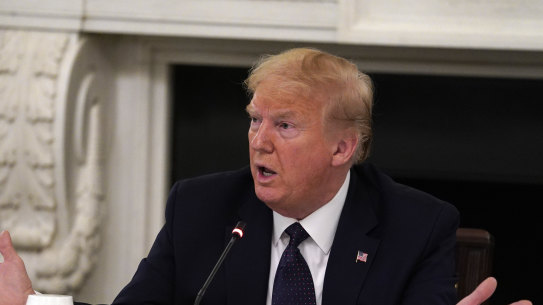 US President Donald Trump tells reporters that he was taking zinc and hydroxychloroquine on May 18. 