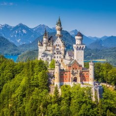 Fussen, Germany - August 7, 2015: Beautiful view of world-famous Neuschwanstein Castle, the nineteenth-century Romanesque Revival palace built for King Ludwig II on a rugged cliff, with scenic mountain landscape near Fussen, southwest Bavaria, Germany. SatApr29Germany