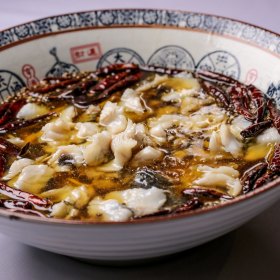 Murray Cod with Chinese herbs and spices in oil bath.