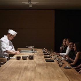 Take a seat at the sushi counter.