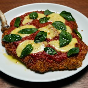 Bone-in veal parmigiana.
