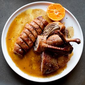 Wood-roasted half duck with burnt butter and mandarin. 