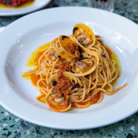 Spaghetti with nduja, clams and white wine.