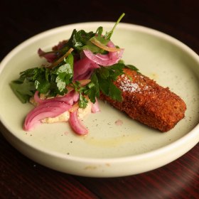 Crumbed pork terrine with preserved lemon and parsley salad.