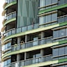 Tradesmen work to fix the cracking at Opal Tower that caused residents to be evacuated twice in a week.