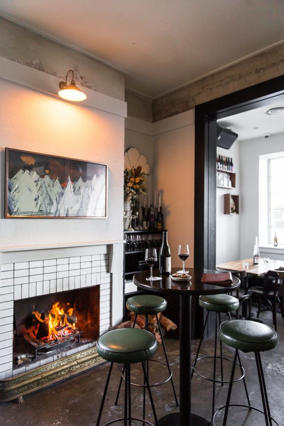 The dining room has a fireplace. 