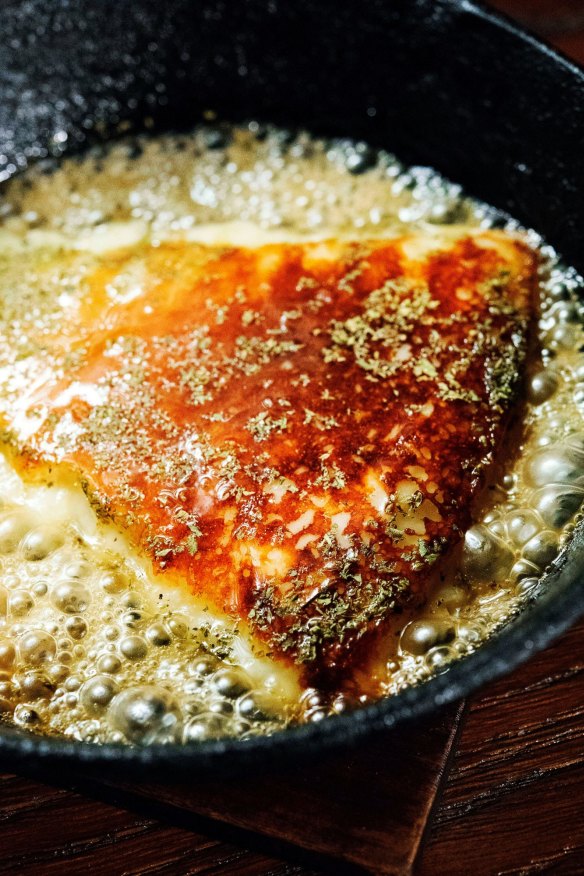 Saganaki cheese with honey and oregano.