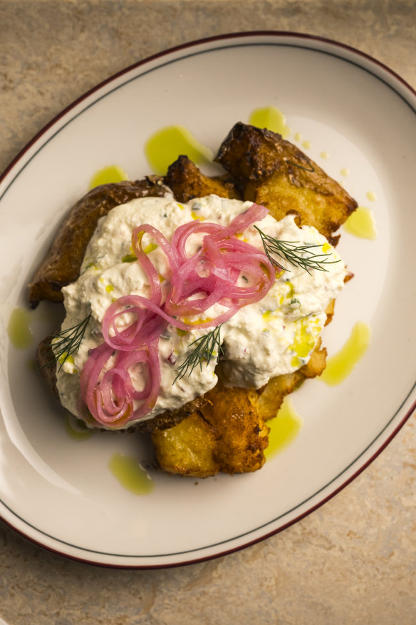 Smashed potatoes with fresh sour cheese.