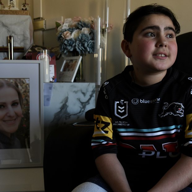 Nicholas Tadros sits by a portrait of his late mother, Vanessa, at the family’s Glenmore Park home.