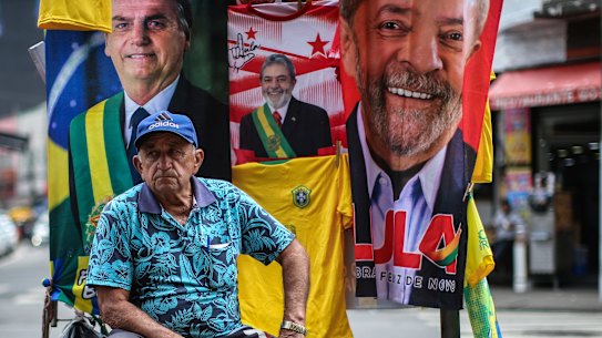 A street vendor in Sao Paulo with images of presidential candidates Lula da Silva and Jair Bolsonaro.