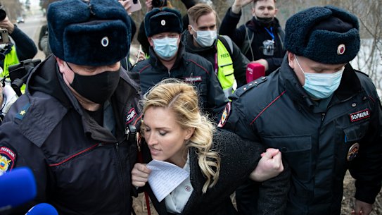 Police officer detain Dr Anastasia Vasilyeva outside the prison where Alexei Navalny is being held.