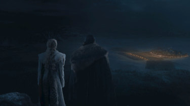 Daenerys and Jon survey the battlefield from on high.