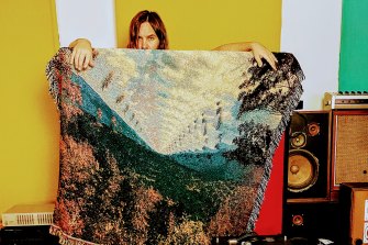 Kevin Parker at home with the Tame Impala blanket.