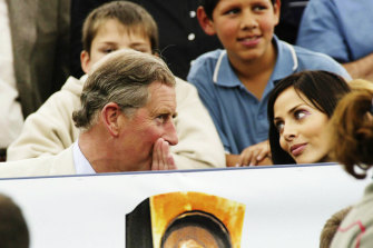 Natalie sitting next to Prince Charles at Party in the Park in 2002.