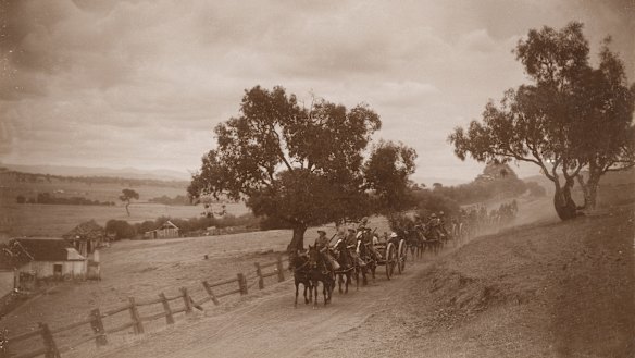 Horse-drawn artillery teams travel along Lavarack Road, Duntroon in 1914. 