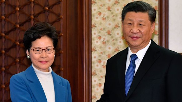 Hong Kong's leader Carrie Lam with Xi Jinping. Lam will have the power to pick judges in national security cases.
