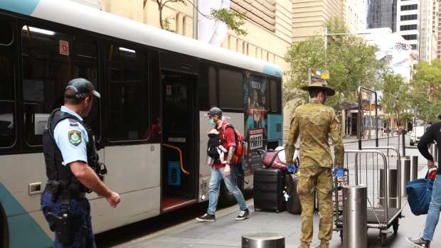 Passengers arriving at the Hilton Hotel CBD to start their quarantine.