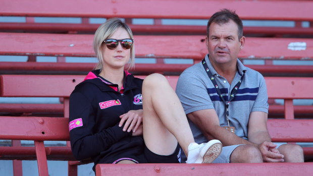 Ellyse Perry watches her teammates at North Sydney Oval last weekend.