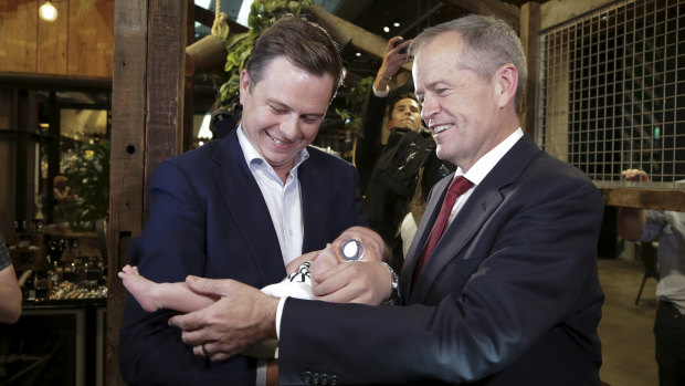 Bill Shorten and his chief of staff, Ryan Liddell, with his baby, Ivy, during the election campaign.