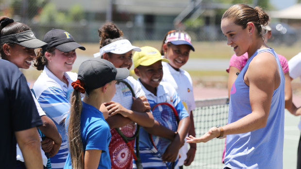 Wednesday: Talking tennis during a clinic in Cairns with youngsters.