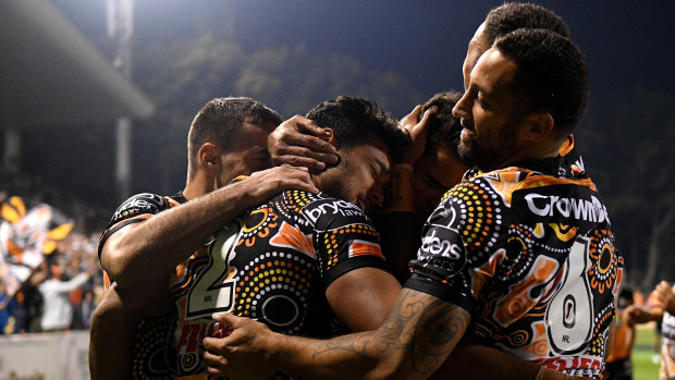 Party time: The Tigers celebrate on their way to victory over the Cowboys on Thursday night.